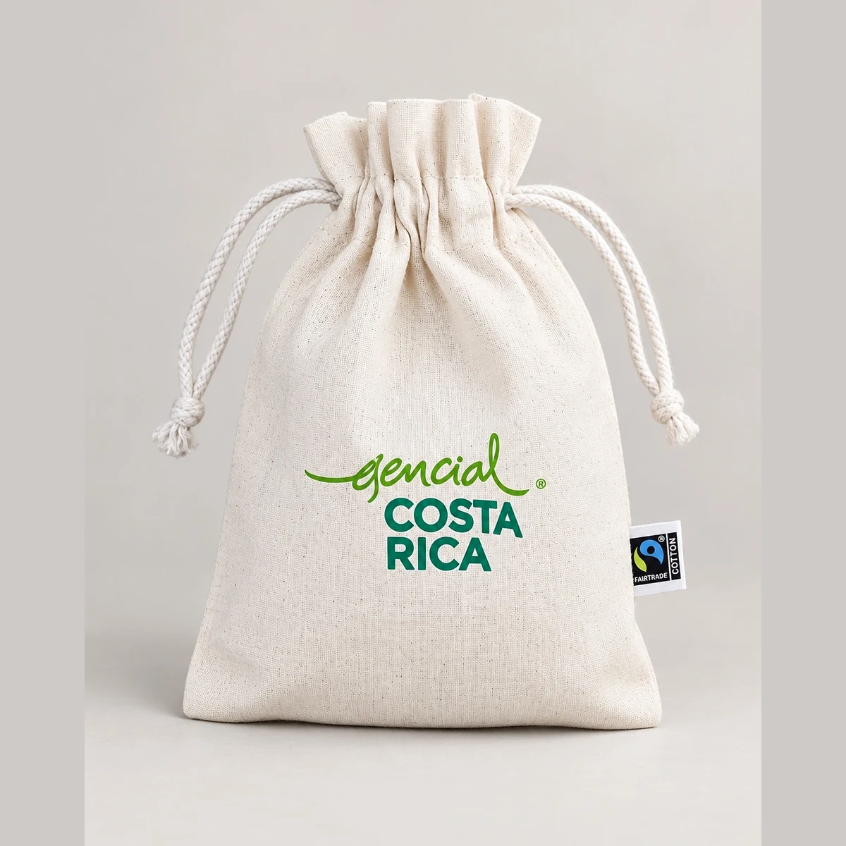 Bolsa de algodón natural con cordón y logotipo original Esencial Costa Rica, trabajo de personalización